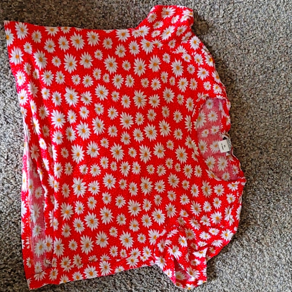 A Monki xs with a red bace and yellow and white flowers